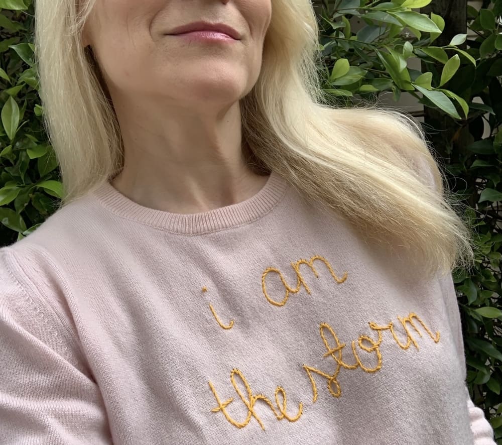 Brand strategist, Liz Dennery, wears 'I am the Storm' sweater