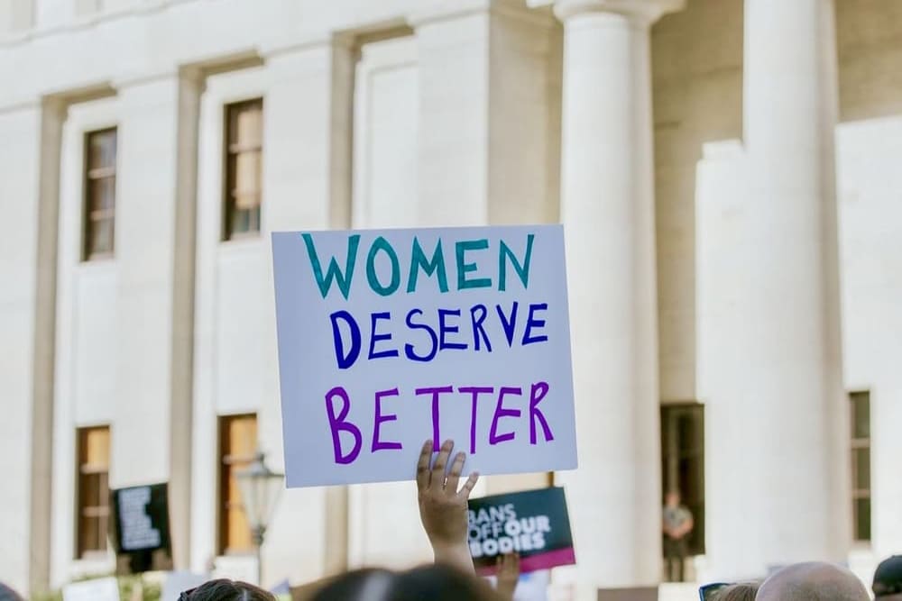 Why It’s More Important Than Ever to Build Your Brand - image of abortion rights protest sign saying women deserve better